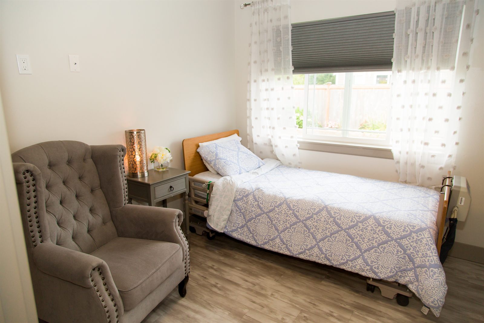 A private bedroom with a large window