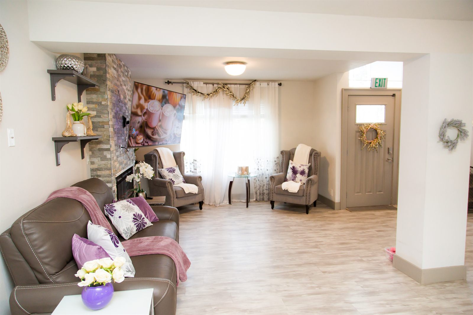 Shared living area with sofa and armchairs